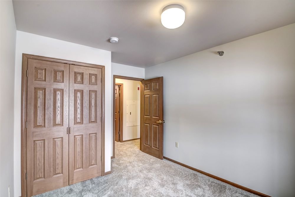 second bedroom facing door and closet