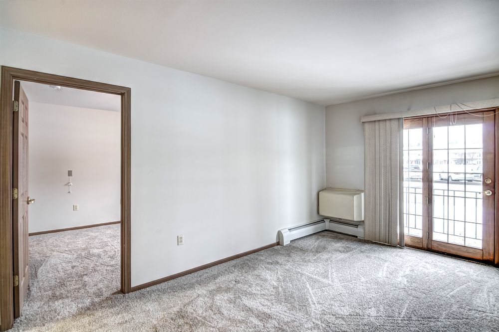 living room with entrance to bedroom