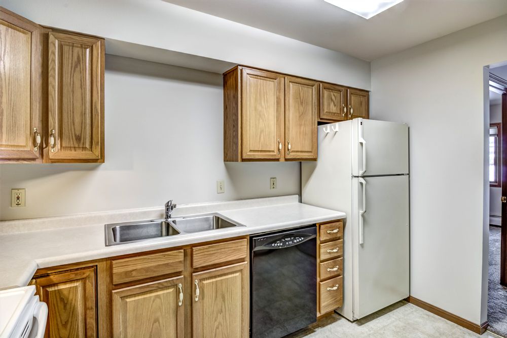 kitchen facing sink and fridge